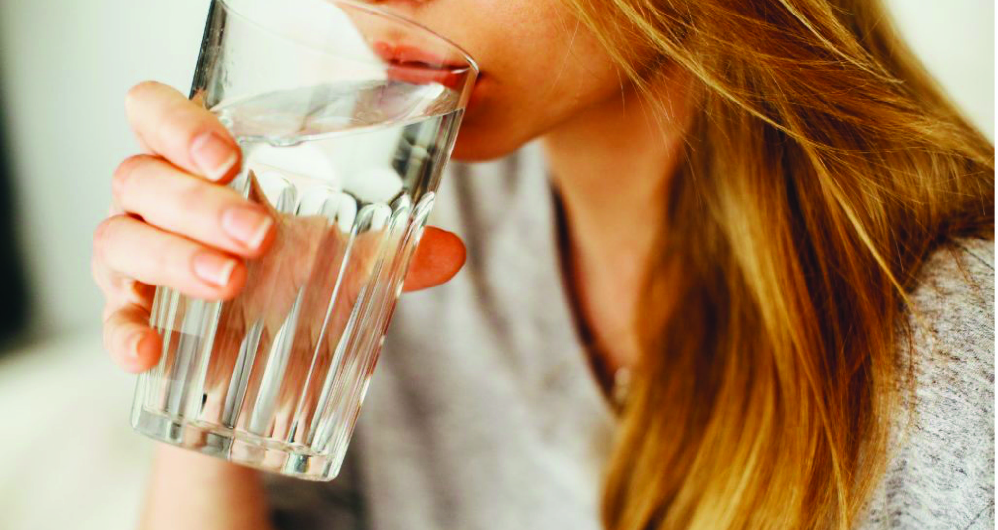 woman drinking fresh water